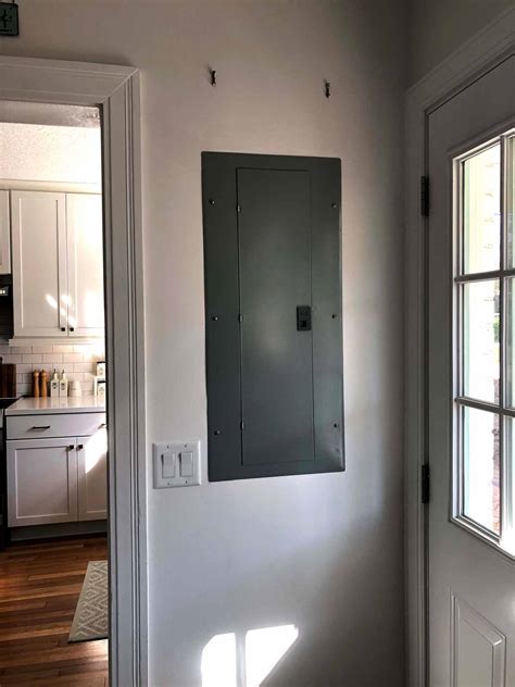 decorating when electric panel box is on entrance wall|how to hide electrical panel.